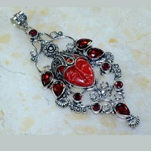 New Carved Goddess Face Silver and Garnet Pendant.